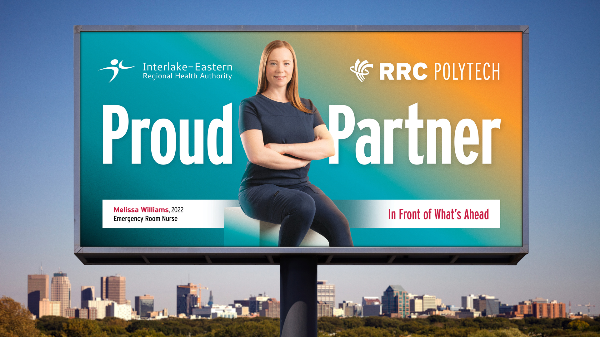RRC Polytech Nursing graduate Melissa Williams confidently sits in her dark blue scrubs on a billboard situated above the Winnipeg city skyline.
