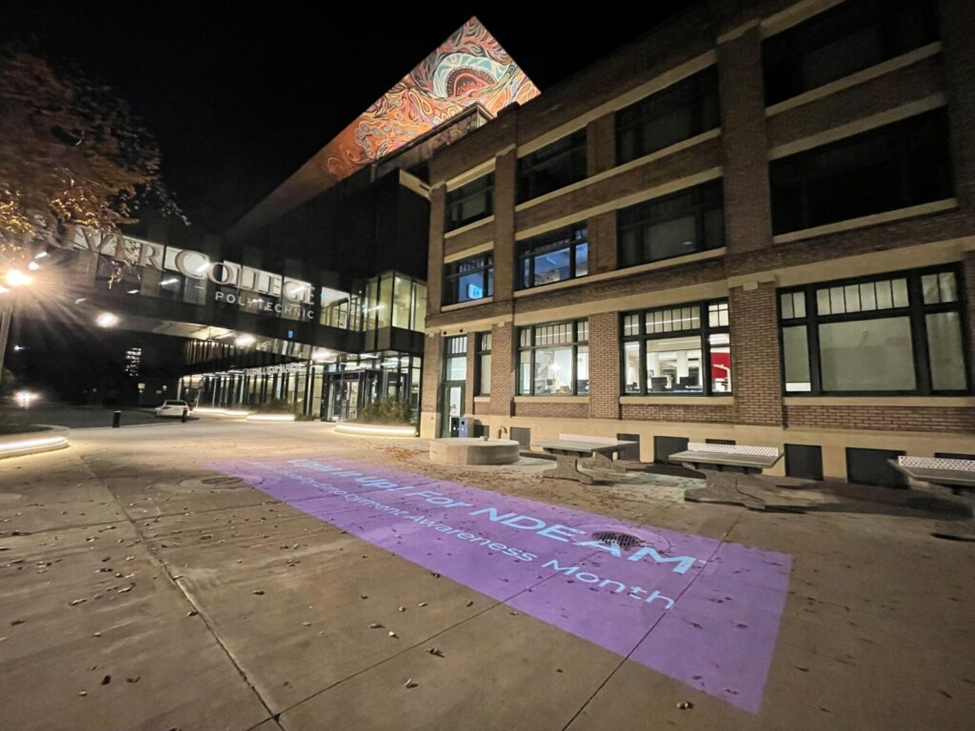  “Light It Up! for NDEAM” graphic on the Elgin Plaza EDC Campus. 