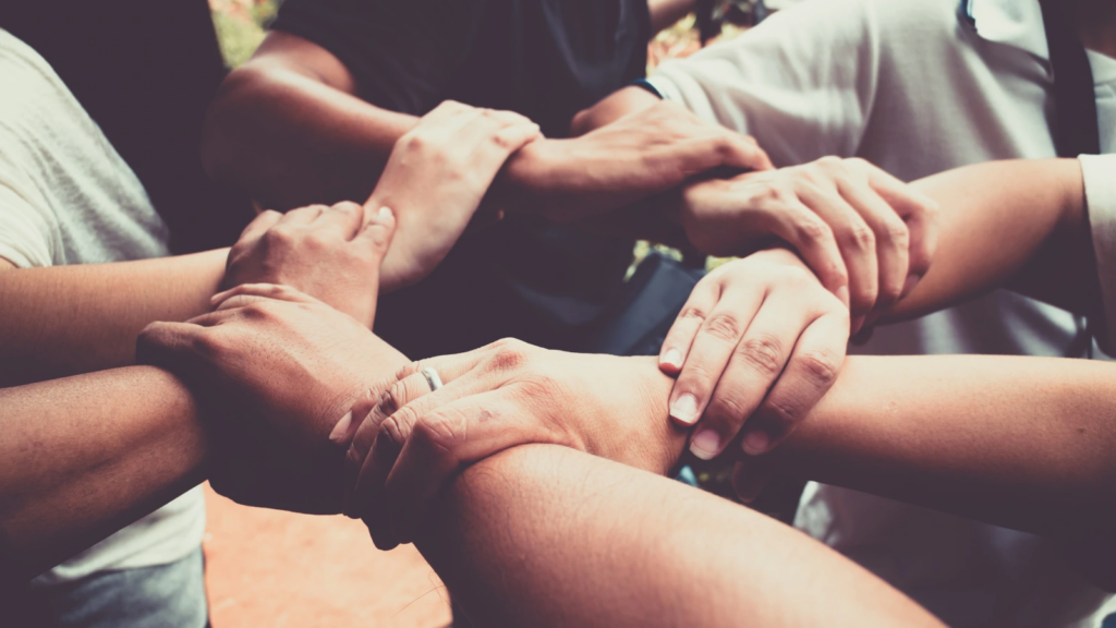 Hands joining together in a circle