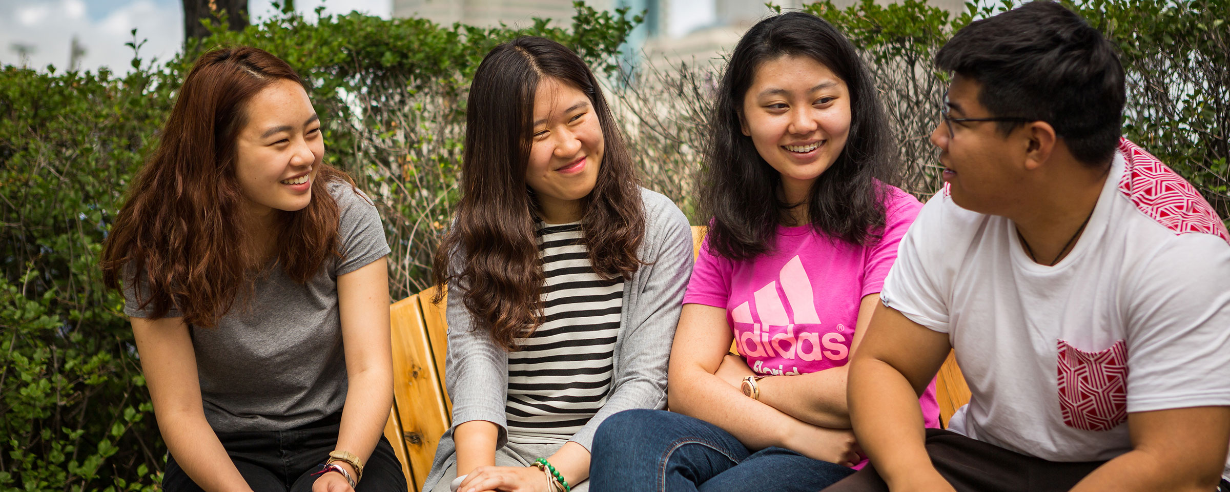 Students sitting outside and talking