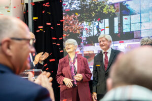 Walter and Maria Schroeder smile as confetti falls around them, at event announcing RRC Polytech as the home of the Schroeder Institute of Entertainment and Media Arts.