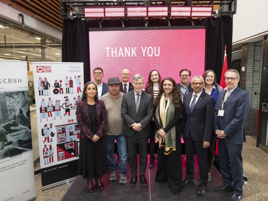 Group shot of RRC Polytech research staff and stakeholders, taken at funding announcement at the College's Skilled Trades and Technology Centre.