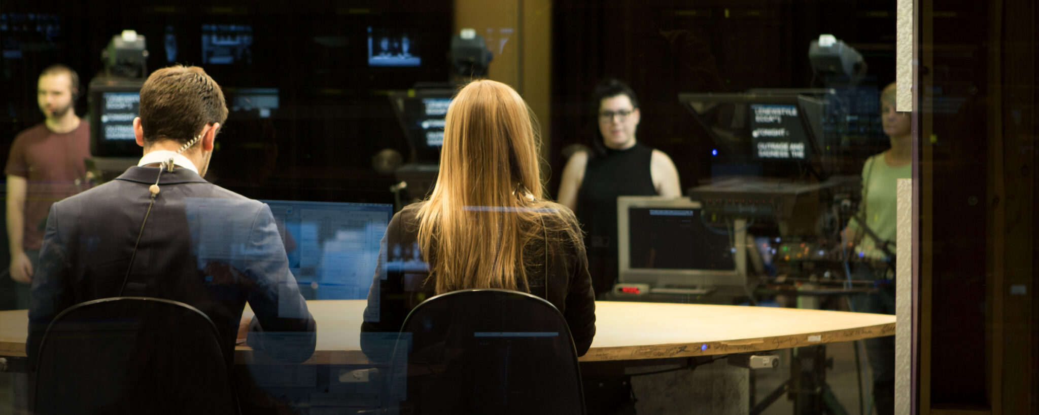 Students sitting in a TV studio