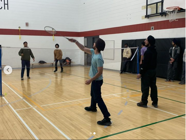 A group of students playing badminton.