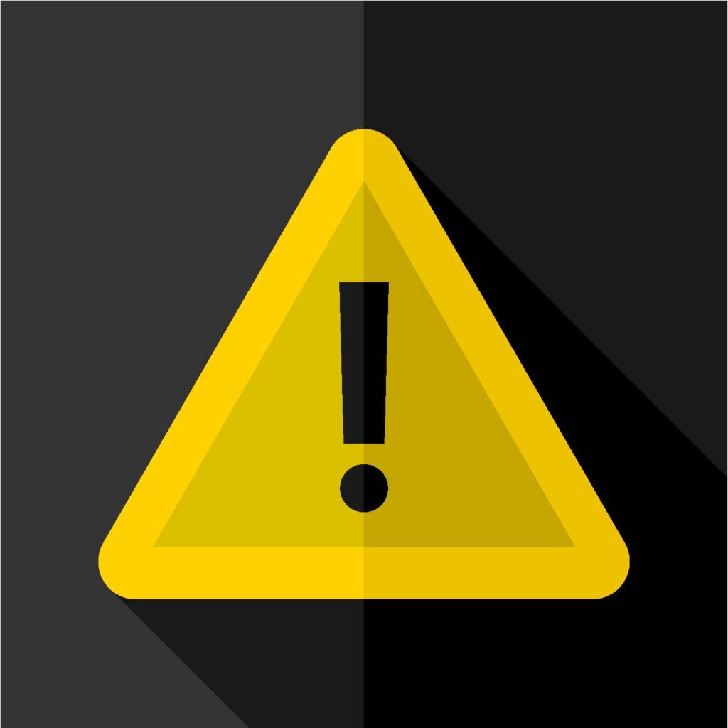 A yellow warning triangle with an exclamation mark in the center, set against a dark background symbolizing caution or alert.