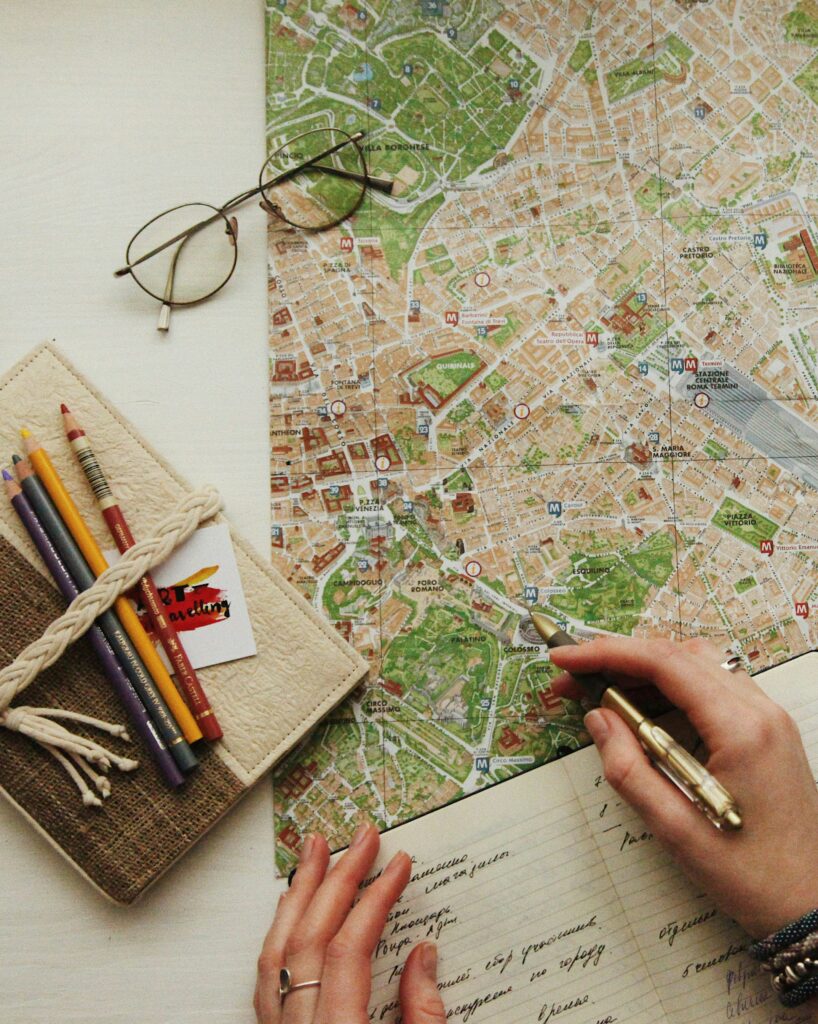 Person looking at a map taking notes.