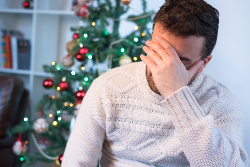 Man felling depressed and lonely during the Christmas time.