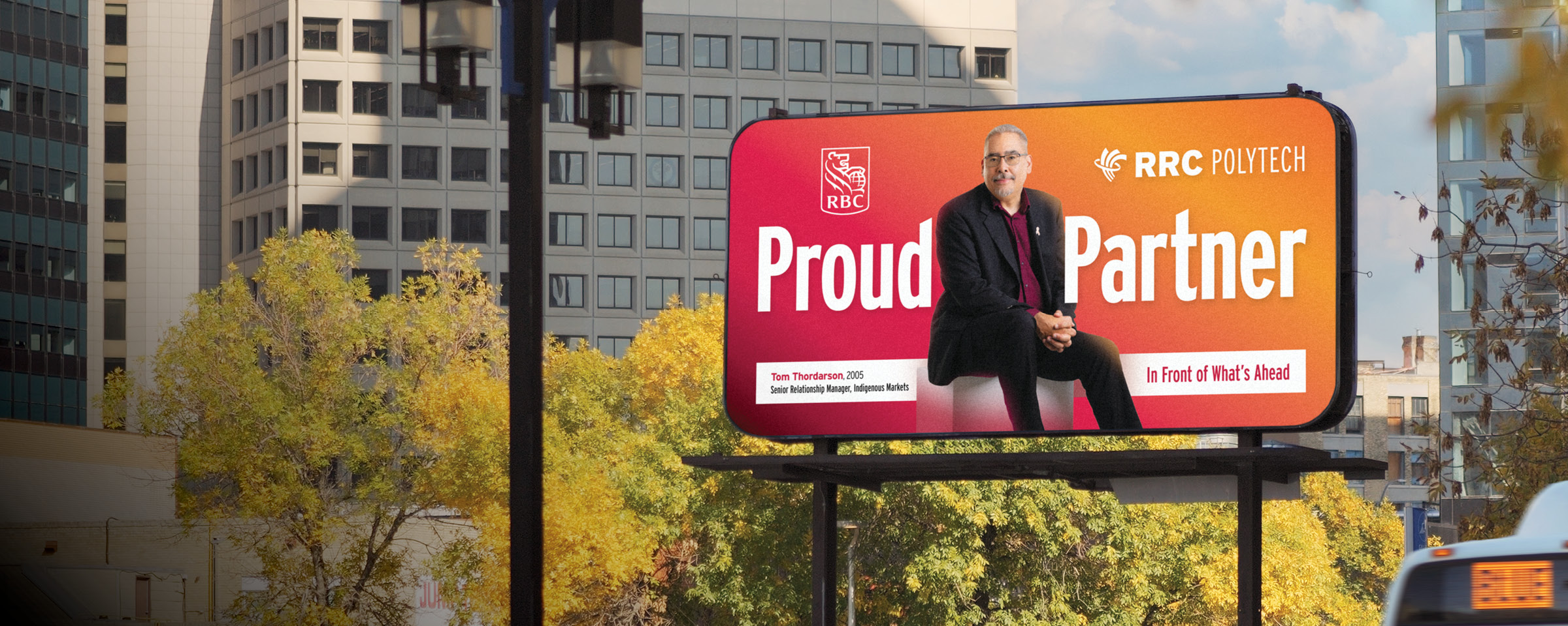 Winnipeg skyline with "Proud Partner" billboard of RRC Polytech graduate Tom Thordarson.