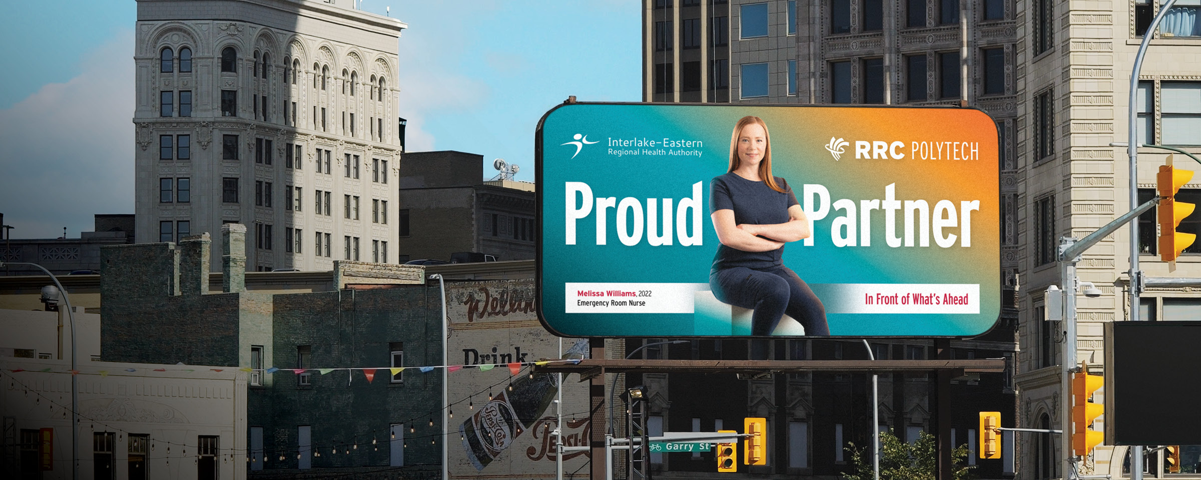 Winnipeg skyline with "Proud Partner" billboard of RRC Polytech graduate Melissa Williams
