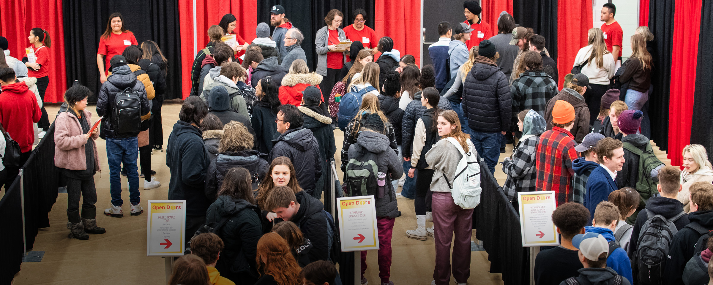 Students waiting in lines to take tours during RRC Polytech's Open Doors event.